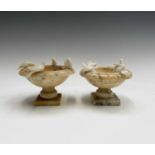 A pair of mid century Italian carved alabaster sculptures of bird baths, each with four doves.