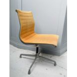 Charles Eames, An office chair, by Herman Miller, with cast aluminium swivel base, height 85cm.