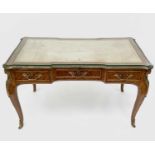 A Victorian bureau plat or desk, English in Louis XV style, kingwood veneered and with ornate gilt