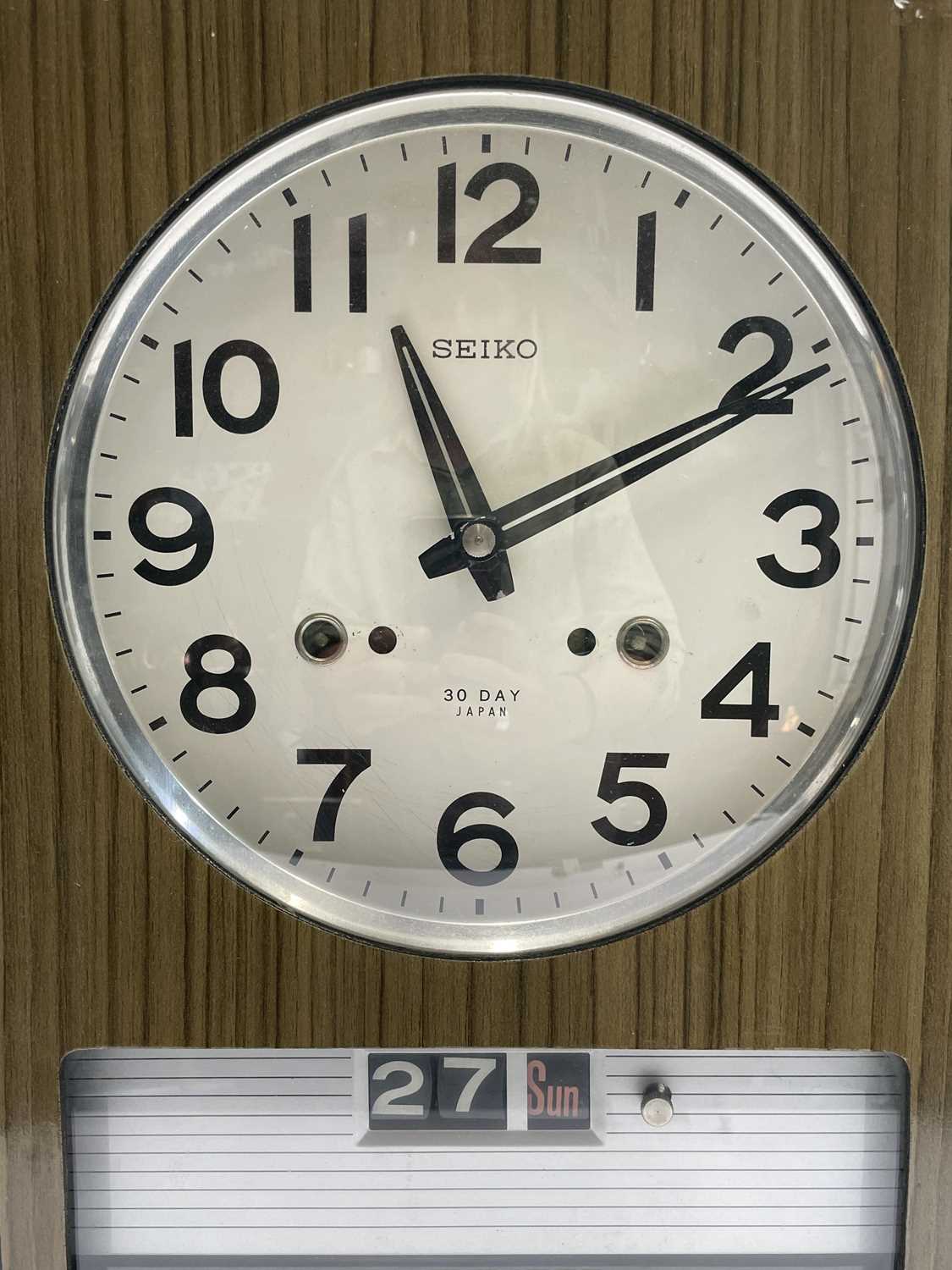 A Seiko Time-Dater thirty-day wall clock, 1960s, with digital day/date and woodgrain finish height - Image 5 of 7