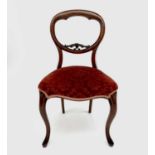 A set of six Victorian rosewood balloon back dining chairs, with moulded and carved backs, stuff