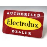 A 1960s glass advertising plaque 'Authorised Electrolux Dealer', 31X51cm.