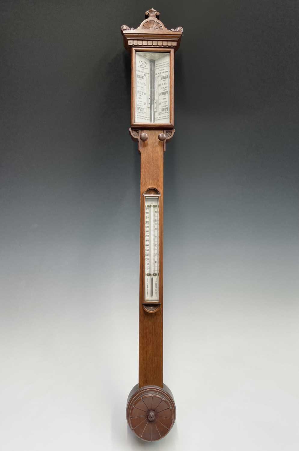 A Victorian walnut stick barometer, by J Hicks, London, with ivory scales, twin vernier indicators