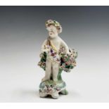 A late 18th century Derby porcelain figure of a cherub with floral encrusted decoration, height 13.