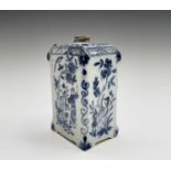 A Dutch Delft tea caddy, 18th century, of rectangular section, painted in blue and white with