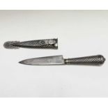 An Argentinian gaucho knife, mid 20th century, with spiral white metal grip and similarly