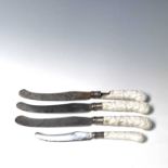 Three Chelsea prunus moulded blanc de chine pistol grip knives, length 28cm, together with one
