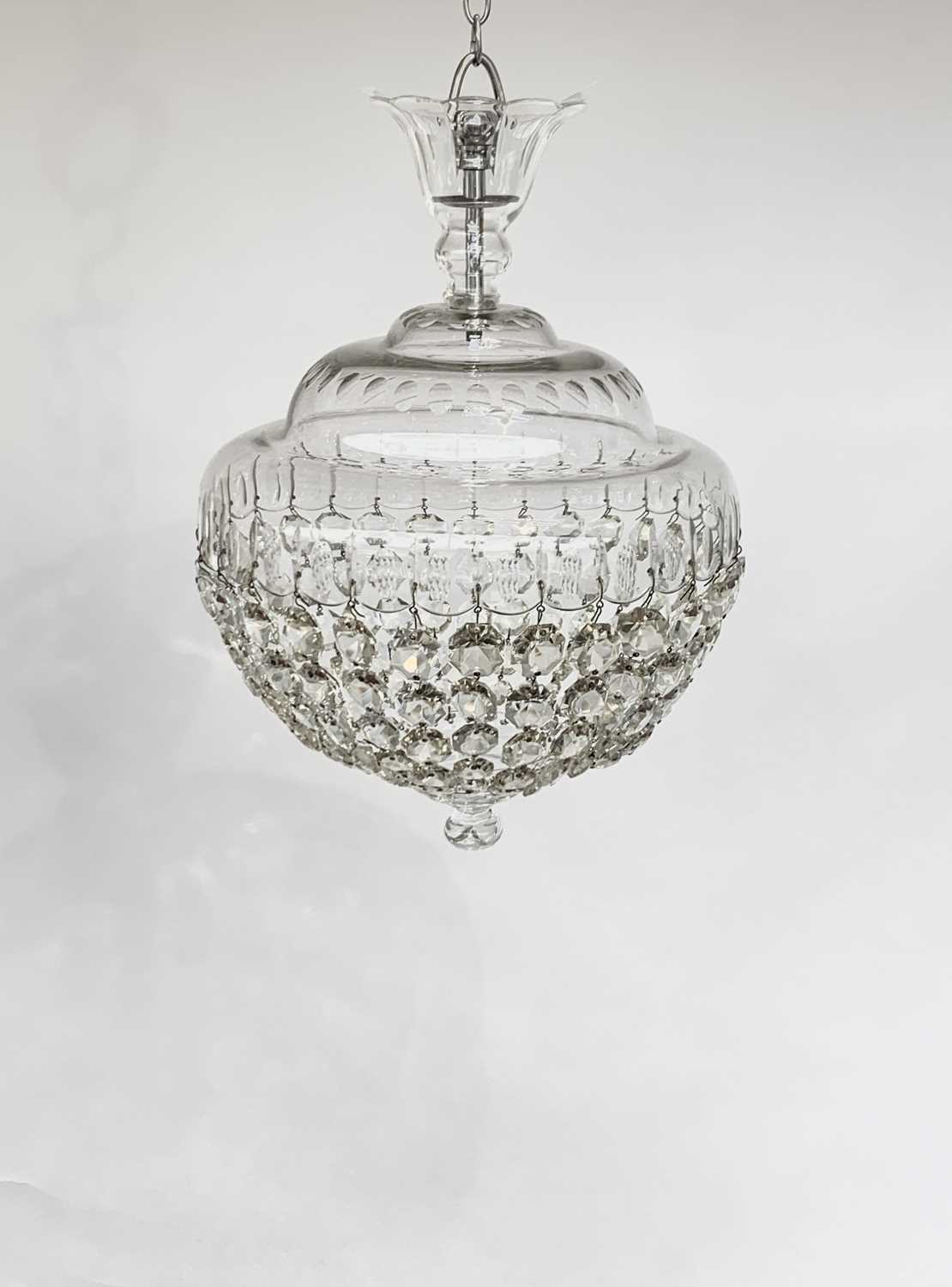 A cut glass electrolier, 20th century, with domed circular top and pendant bag drops, diameter