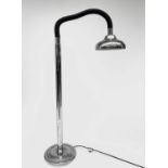 A chrome standard lamp, later 20th century, with flexible upper stem, dished shade and circular