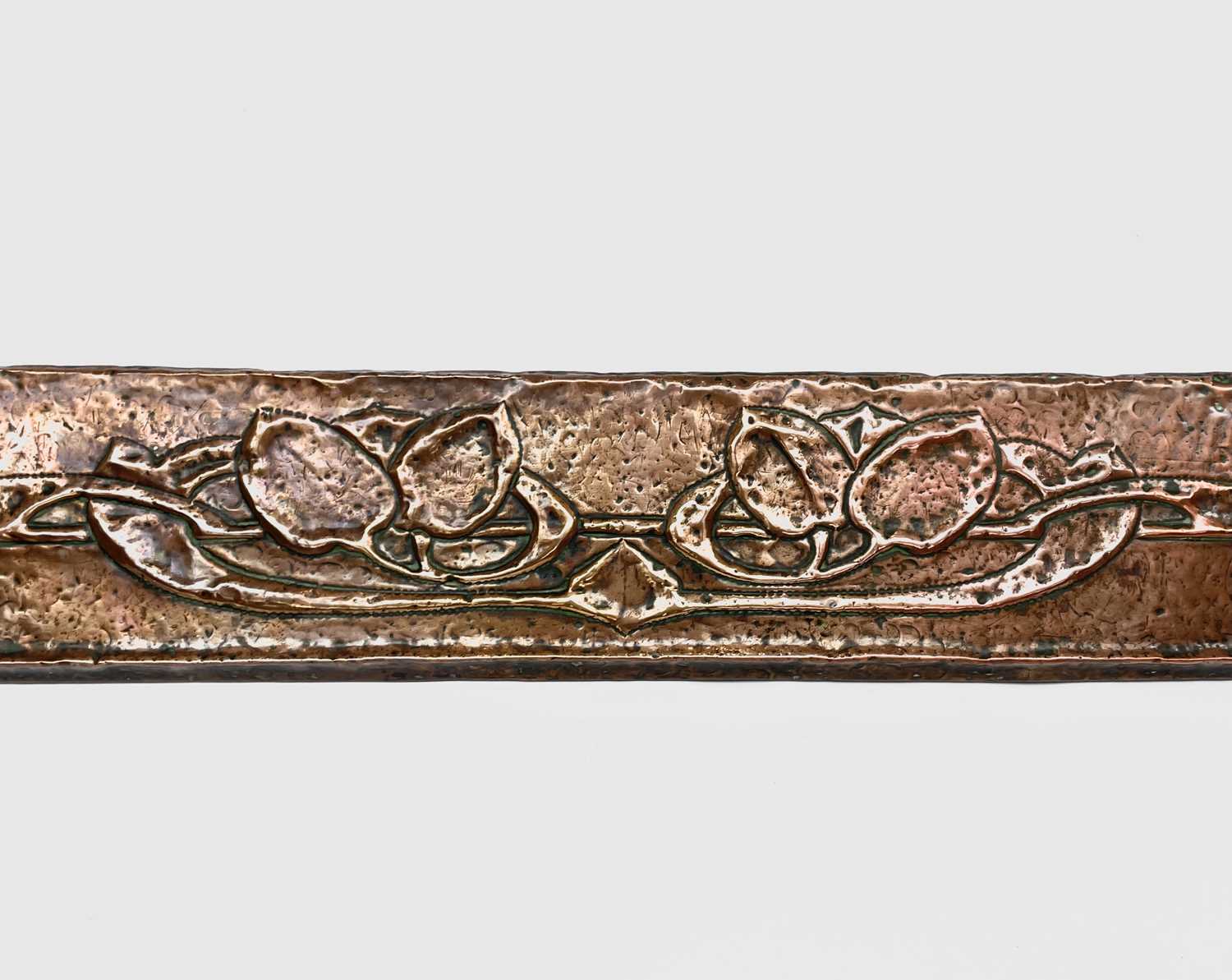 An Arts and Crafts copper fender, embossed with stylised foliage, width 142cm.Condition report: No - Image 3 of 4