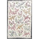 A cream ground rug/wall hanging with floral crewelwork decoration. 177 x 118.5cm.