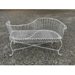 A wrought iron garden love seat, width 116cm.