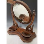 A Victorian mahogany swing toilet mirror, with oval plate, the base fitted two jewellery