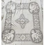 A machine lace counterpane with large cherub motifs, 220 x 220cm approx. (plus 20 cms fringing).