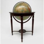 A 50cm diameter Philips' terrestrial globe, circa 1965, on a Regency style mahogany stand. Overall