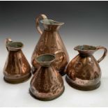 A set of four late 19th/early 20th century graduated copper 'harvest' measures, the largest