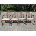 A set of four George III style mahogany dining chairs, early 20th century, with pierced vase splats,