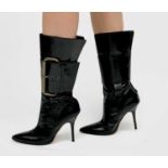 Manolo Blahnik. High heeled black leather pirate style boots, with oversized buckle feature. Rear