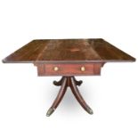 A Regency mahogany Pembroke table, fitted with a single end drawer, and raised on a turned central