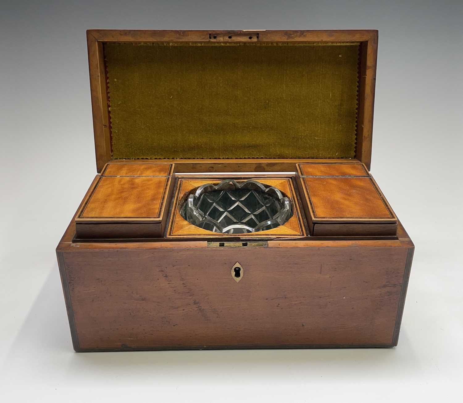 A George III satinwood and rosewood banded tea caddy, fitted with two lidded compartments and a