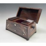 A Regency rosewood and mother of pearl inlaid tea caddy, fitted with two lidded compartments,