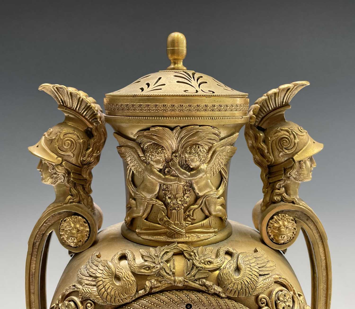 A French Empire ormolu cased mantel clock, of urn form, the covered rim applied with two winged - Image 11 of 12