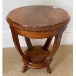A Biedermeier style circular two tier occasional table, late 19th century with swept supports,