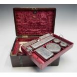 An early Victorian mahogany and brass campaign Gentleman's toilet box, the red Morocco leather and