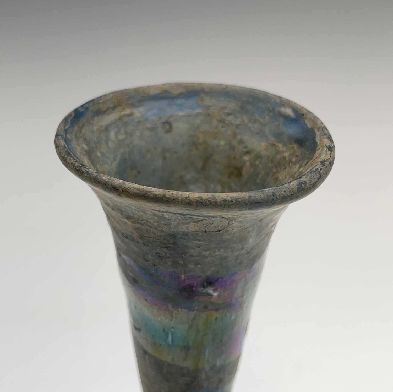 Three iridescent glass vessels, possibly Roman, comprising a ewer, height 13cm, and two vases. - Image 13 of 16