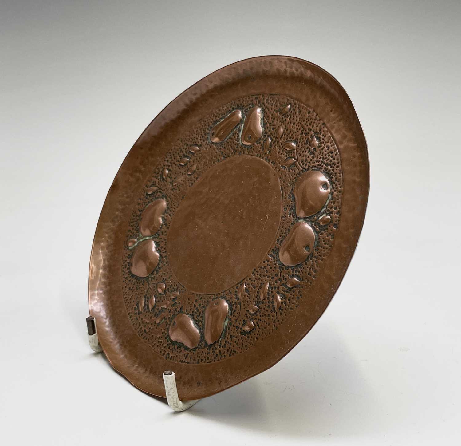 A Newlyn copper small circular dish, repousse decorated with apples and pears on a planished ground, - Image 3 of 6