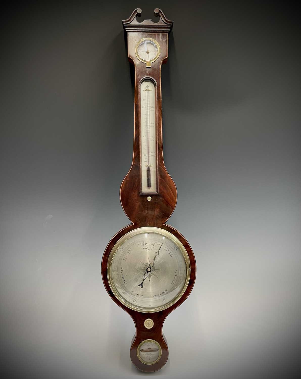 A George III mahogany and boxwood strung wheel barometer by J Berry of 78 Wardour Street Soho.