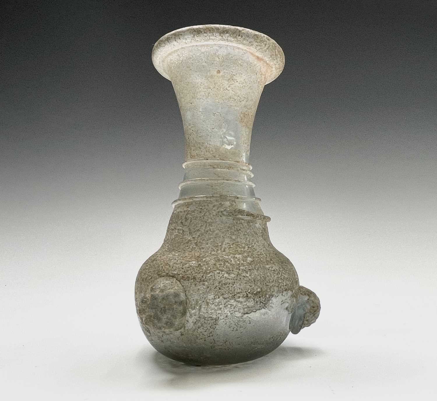 Three iridescent glass vessels, possibly Roman, comprising a ewer, height 13cm, and two vases. - Image 10 of 16