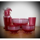 A Victorian cranberry glass bowl with applied white trailing decoration, diameter 14cm, together