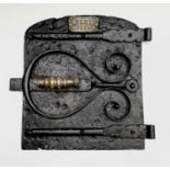 A heavy cast iron Cornish range door, late 19th century, the brass plaque bearing inscription 'R.