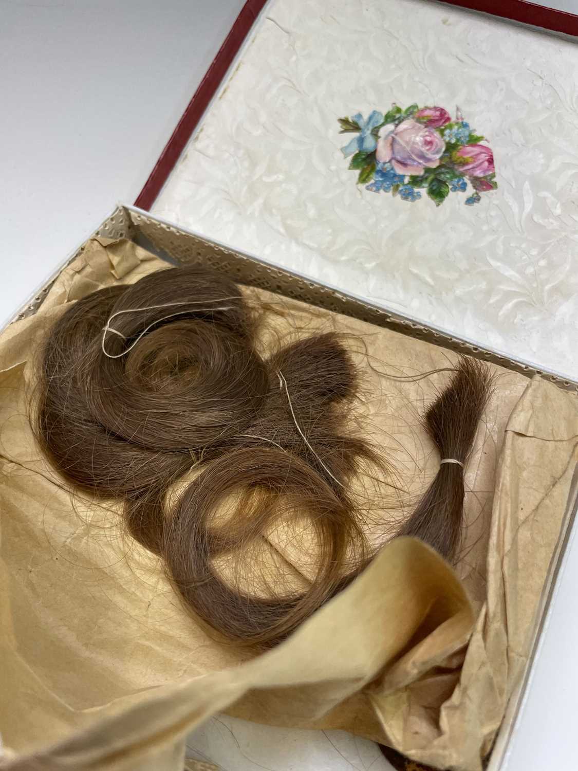 A box containing a collection of locks of hair, together with another box containing a pair of kid - Image 6 of 6