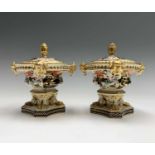 A pair of early 19th century Derby porcelain imari and gilt decorated pot pourri vases, of squat