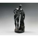 An Italian green serpentine figure of Hercules, late 19th century, carved standing beside a
