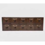 A bank of Victorian stained pine apothecary drawers with turned ebonised handles. Height 31cm, width