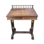 A Regency mahogany clerk's desk, with spindle gallery and sloping top, flanked by two drawers with