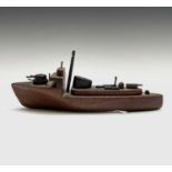 A hand-built toy model gunboat, the timber from the wreck of HMS Warspite, length 22cm.