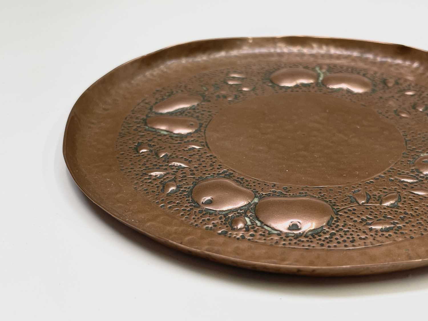 A Newlyn copper small circular dish, repousse decorated with apples and pears on a planished ground, - Image 6 of 6