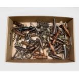 A large collection of corkscrews, many 19th century, including some with brushes, folding bow type