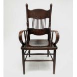 An American walnut armchair, circa 1900, height 112cm, width 60cm.