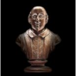 A carved mulberry wood bust of Shakespeare, the reverse carved 'Mulberry wood from New Place