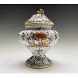 An armorial tin glaze pottery jar and cover, circa 1900, with floral painted decoration, height