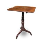 A George III mahogany pedestal occasional table, the rectangular top raised on a turned column and