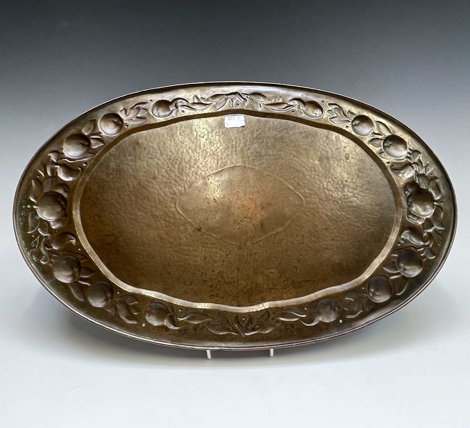 A Newlyn copper oval tray, circa 1910, the raised edge with twin handles, the border repousse - Image 7 of 8