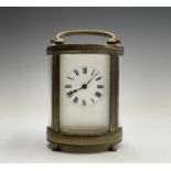 A French oval brass cased carriage timepiece, early 20th century. Height 12.5cm.