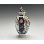 A Worcester porcelain tea caddy and cover, circa 1780, of fluted ovoid form, decorated with Kakiemon