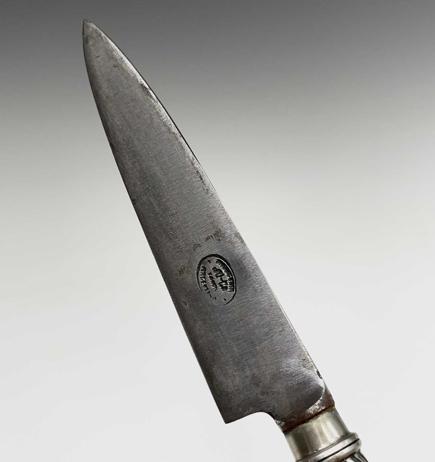 An Argentinian gaucho knife, mid 20th century, with spiral white metal grip and similarly - Image 4 of 9